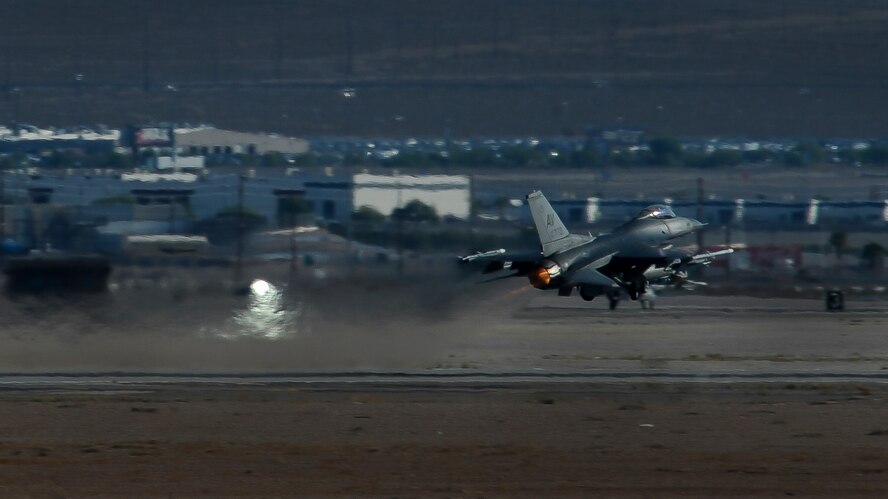 An F-16, assigned to the 555th Fighter Squadron, Aviano Air Base, Italy, takes off at Nellis Air Force Base, Nev., Aug. 2, 2016. Green Flag, in support of the US Army's National Training Center, provides invaluable combat training to Joint and Coalition warfighters in the art of air-land integration and the joint employment of airpower. (United States Air Force photo by Airman 1st Class Kevin Tanenbaum/Released)