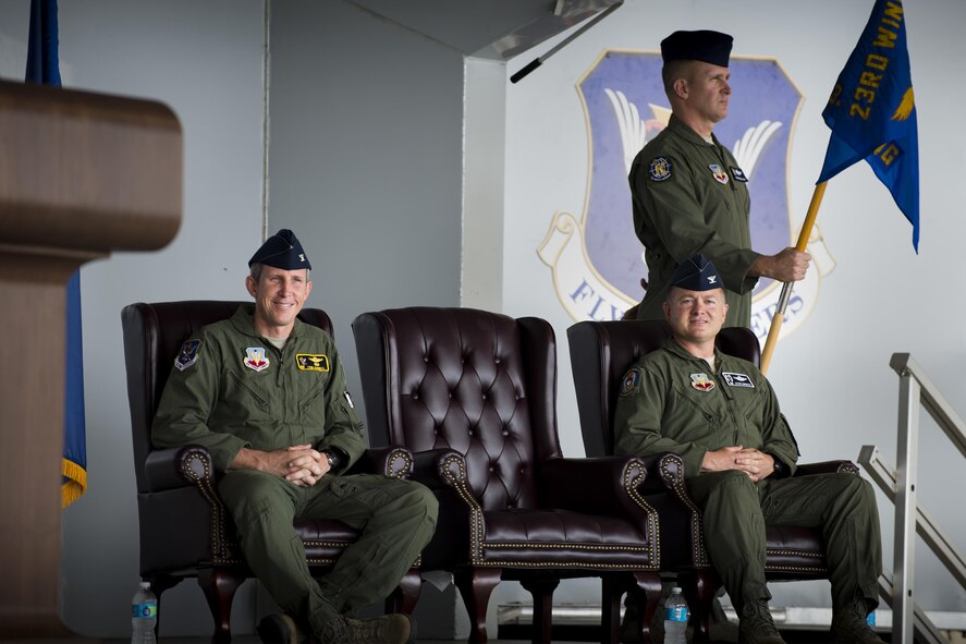 U.S. Air Force Col. Thomas Kunkel, 23d Wing commander, and Col. Jason Gingrich, 347th Rescue Group incoming commander, listen to remarks, August 2, 2016, at Moody Air Force Base, Ga. Gingrich is an HH-60G Pave Hawk pilot with over 2,500 flying hours and 170 combat hours. (U.S. Air Force photo by Airman Daniel Snider)