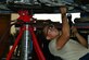 U.S. Air Force Airman 1st Class Taylor Elcook, 633rd Logistics Readiness Squadron vehicle maintenance apprentice, replaces the engine wiring harness in a police vehicle at Langley Air Force Base, Va., Aug. 2, 2016.  The vehicle maintenance shop assists the base by keeping all the government vehicles operating properly for the overall mission. (U.S. Air Force photo by Airman 1st Class Tristan Biese)