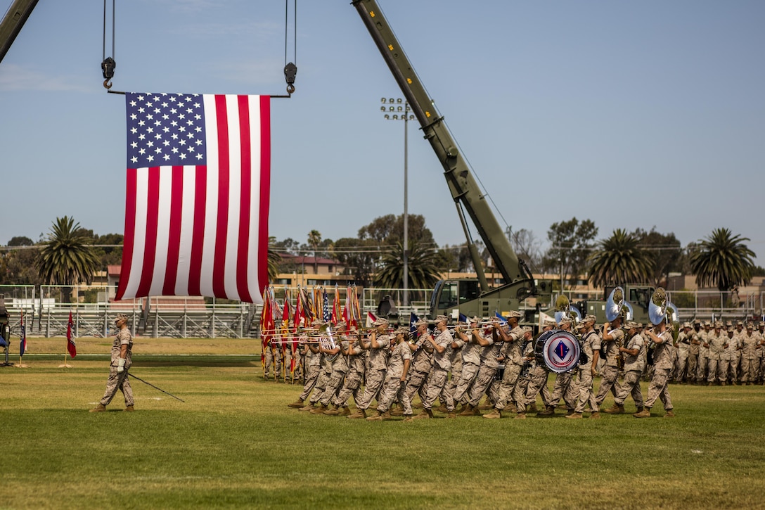 U.S. Marine Corps GySgt. Benjamin P. Becker, drum major, 1st Marine Division Band, directs the band during the I Marine Expeditionary Force change of command ceremony at Marine Corps Base Camp Pendleton, Calif., July 27, 2016. The change of command ceremony signifies the transfer of responsibility and authority over the IMEF between Commanding Generals. 