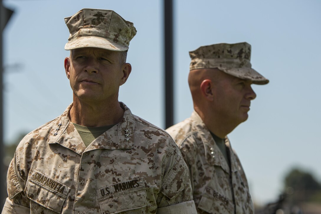 U.S. Marine Corps Lt. Gen. Lewis A. Craparotta and Lt. Gen. David H. Berger observe the pass in review segment during the I Marine Expeditionary Force change of command ceremony at Marine Corps Base Camp Pendleton, Calif., July 27, 2016. The change of command ceremony signifies the transfer of responsibility and authority over the IMEF between Commanding Generals.