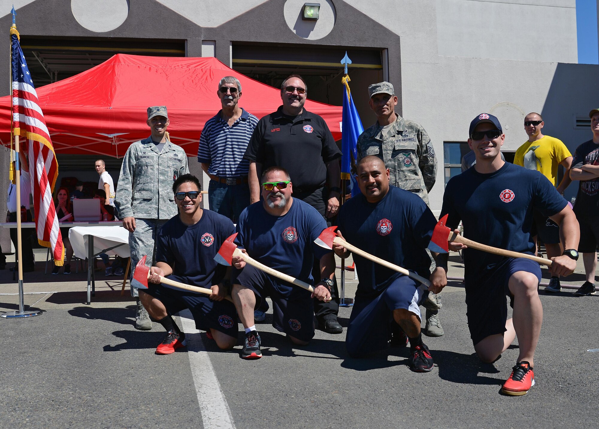 Firefighters from Fire Station 105 on McChord Field pose for a group photo after winning first place in the firefighter combat challenge July 26, 2016 at Joint Base Lewis-McChord, Wash. The first place team completed the course in 3 minutes and 30 seconds. (U.S. Air Force photo/Senior Airman Jacob Jimenez) 