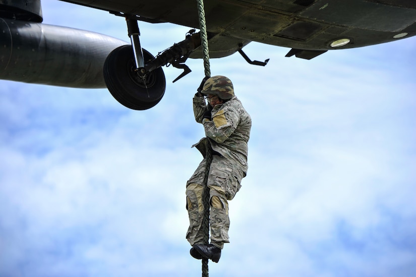 A member of the Belize Special Assignment Group fast ropes out of a UH-60 Black Hawk assigned to Joint Task Force-Bravo’s 1st Battalion, 228th Aviation Regiment during training at Price Barracks, Belize, July 19, 2016. For many of the BSAG participants, this was their first time they were part of Fast Rope Insertion and Extraction System (FRIES) training. (U.S. Air Force photo by Staff Sgt. Siuta B. Ika)