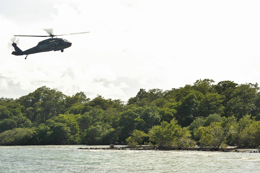 A UH-60 Black Hawk assigned to Joint Task Force-Bravo’s 1st Battalion, 228th Aviation Regiment approaches an extraction point during training in Belize District, July 21, 2016. As the only forward deployed aviation assets in the U.S. Southern Command theater, the 1-228th AVN facilitates USSOUTHCOM’s Theater Engagement Strategy that includes building partner nation capacity to conduct counter-transnational organized crime operations. (U.S. Air Force photo by Staff Sgt. Siuta B. Ika)