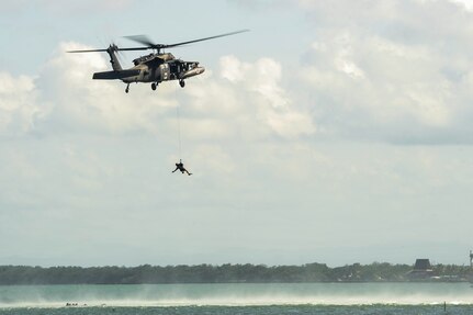 A UH-60L Black Hawk assigned to Joint Task Force-Bravo’s 1st Battalion, 228th Aviation Regiment positions a flight paramedic to extract a role player acting as a patient during an open water hoist training scenario off the coast of Belize District, July 21, 2016. The 1-228th AVN’s U.S. Air Ambulance Detachment Honduras handles all of the battalion’s aeromedical operations, which include both training partner nations and providing real-world MEDEVAC capabilities throughout Central America. (U.S. Air Force photo by Staff Sgt. Siuta B. Ika)