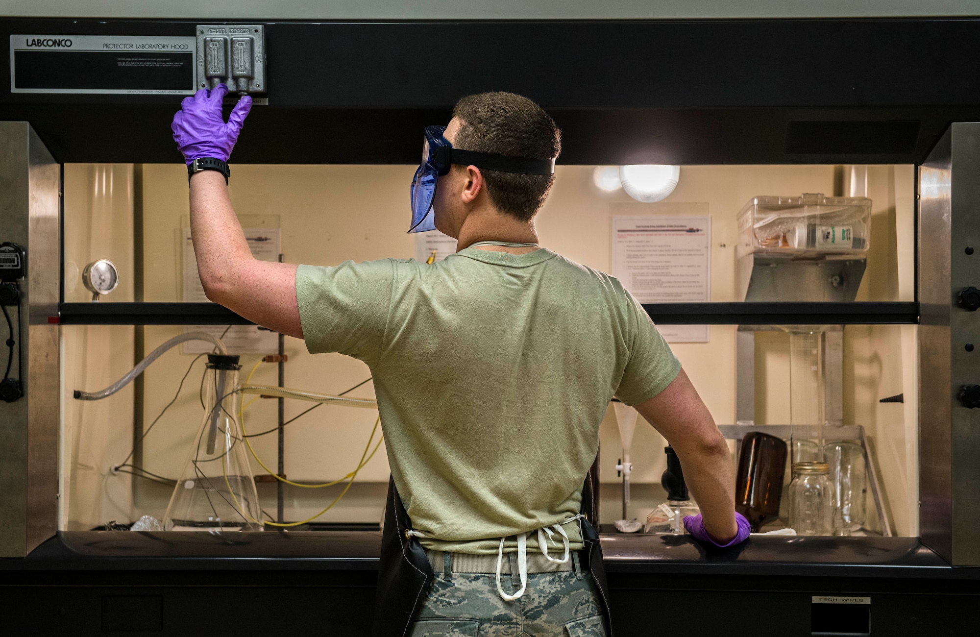 Senior Airman Christopher Buccieri, 375th Logistical Readiness Squadron fuels laboratory technician, tests a fuel sample to determine the presence of particulates. (U.S. Air Force photo by Staff Sgt. Martinez/Released)