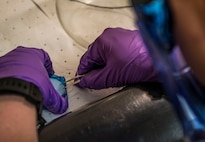 Senior Airman Christopher Buccieri, 375th Logistical Readiness Squadron fuels laboratory technician, tests a fuel sample to determine the presence of particulates. The fuels section provides aircraft and vehicle fuel support to all Scott and base visitors, so it’s important that the fuel is tested. The process is quick, says Buccieri, but too many particles in the fuel could mean the whole batch is unusable. If that’s the case, the batch is retested. If he were to receive the same result, the test sample is sent to another lab off-base for in depth analysis. (U.S. Air Force photo by Staff Sgt. Martinez/Released)