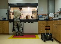 Senior Airman Christopher Buccieri, 375th Logistical Readiness Squadron fuels laboratory technician, tests a fuel sample to determine the presence of particulates. (U.S. Air Force photo by Staff Sgt. Martinez/Released)