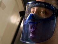 Senior Airman Christopher Buccieri, 375th Logistical Readiness Squadron fuels laboratory technician, tests a fuel sample to determine the presence of particulates. (U.S. Air Force photo by Staff Sgt. Martinez/Released)