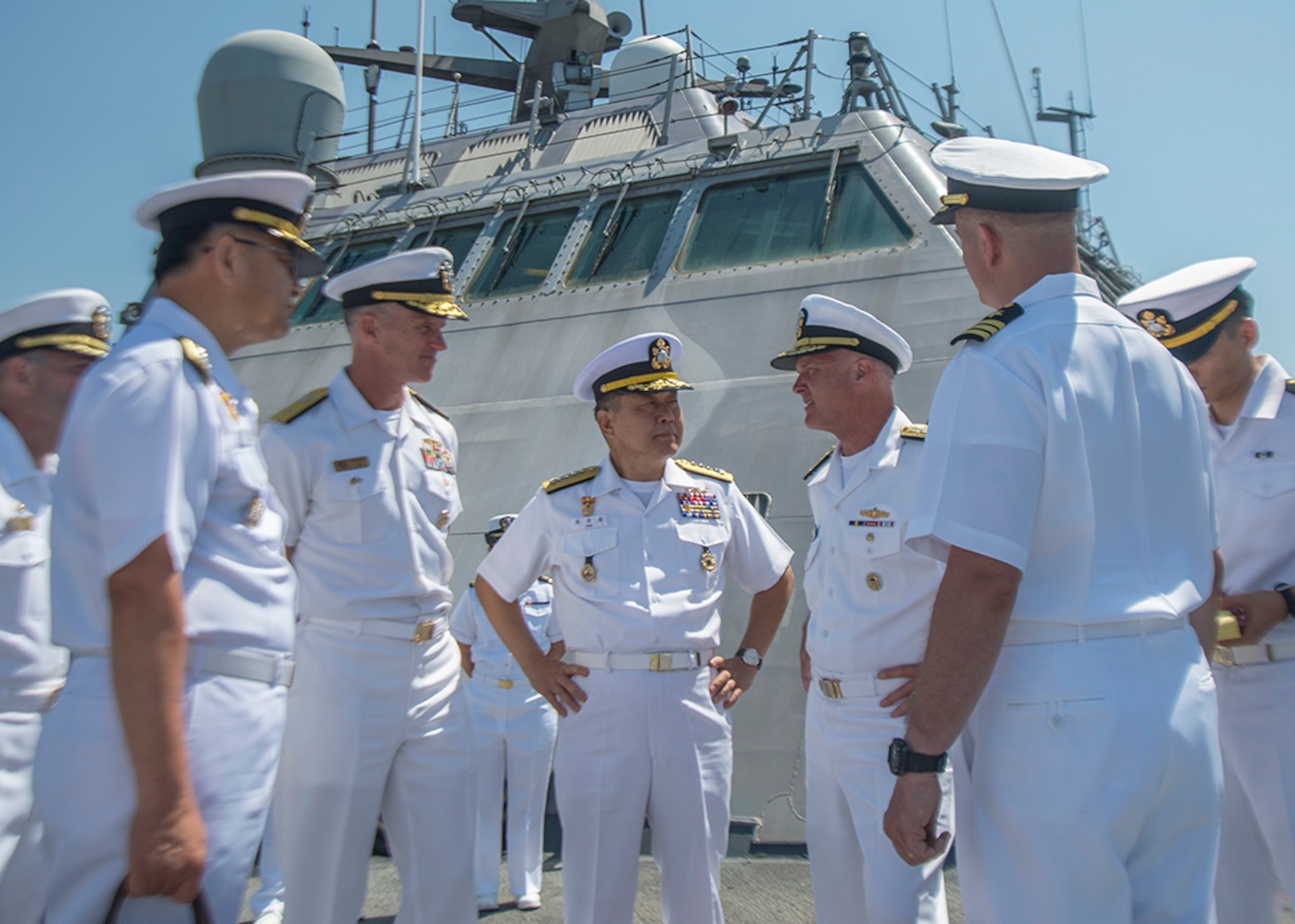 Chief of Naval Operations for the Republic of Korea (ROK), Adm. Jung Ho-Sub, center, and Vice Adm. Tom Rowden, right, commander, Naval Surface Forces, U.S. Pacific Fleet, discuss the capabilities of the littoral combat class ship during a tour led by Cmdr. Michael R. Wohnhaas, commanding officer, USS Freedom (LCS 1). ROK’s top naval officer met with senior military leaders in San Diego to discuss maritime security issues and strengthen the relationship between both navies. 
