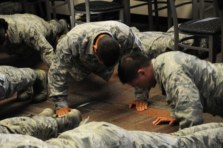 Airmen perform 22 pushups for the 22Kill pushup challenge during the Airman’s breakfast at Schriever Air Force Base, Colorado, Tuesday, Aug. 2, 2016. 22Kill is performed in remembrance for the estimated 22 military veterans who commit suicide every day. (U.S. Air Force photo/Airman William Tracy)
