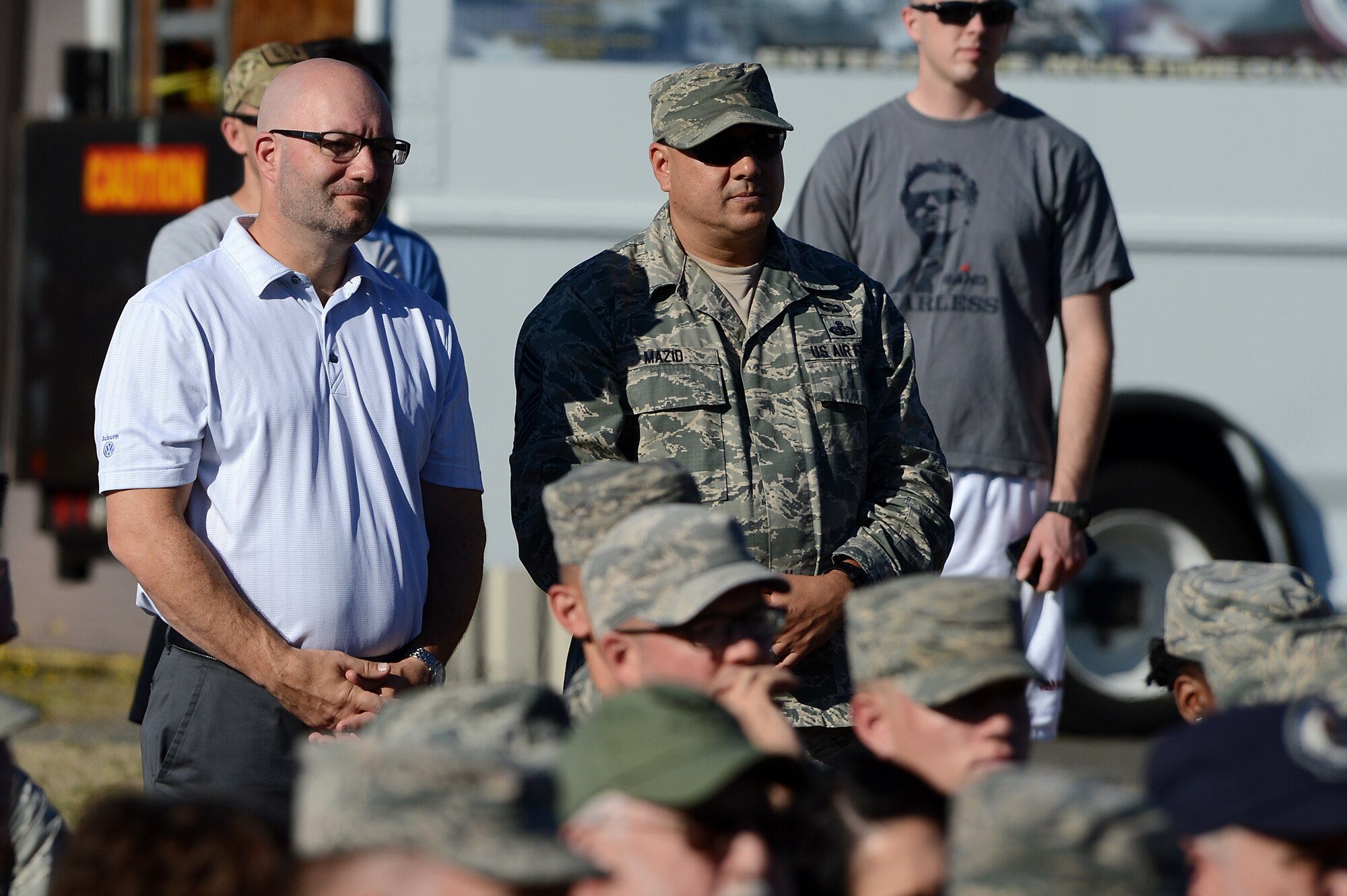Chief Master Sgt. Tico Mazid, 62nd Airlift Wing command chief, and Matt Welch, 62nd AW honorary command chief, attend the Joint Base Lewis-McChord Firefighter Legacy Memorial unveiling July 29, 2016, on JBLM, Wash. Welch spent the day shadowing Mazid and seeing firsthand what a command chief does on base. (U.S. Air Force photo/Senior Airman Divine Cox)