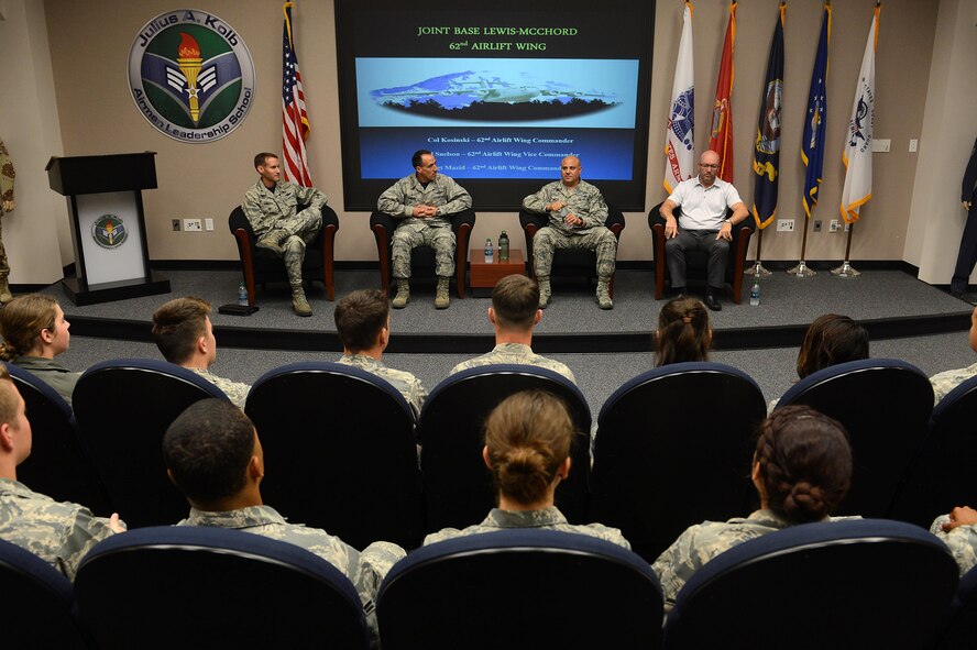 Matthew Welch (far right), 62nd Airlift Wing honorary command chief, visits with Airmen from the First Term Airman Center while shadowing the wing Command Chief July 29, 2016, at Joint Base Lewis-McChord, Wash. Welch joined a panel of leadership to include Col. Leonard Kosinski, 62nd AW commander, Col. Stephen Snelson, 62nd AW vice commander and Chief Master Sgt. Tico Mazid, 62nd AW command chief, as they visited with Airmen from FTAC to welcome them to McChord and answer any questions they had. (U.S. Air Force photo/Senior Airman Divine Cox)