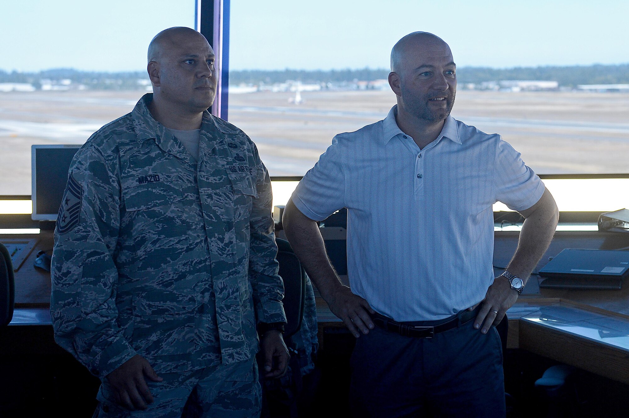 Chief Master Sgt. Tico Mazid, 62nd Airlift Wing command chief, and Matthew Welch, 62nd AW honorary command chief, visit the McChord Field Air Traffic Control tower July 29, 2016, on Joint Base Lewis McChord, Wash. Welch followed up the FTAC visit with the Team McChord quarterly awards ceremony and ended his visit with meeting Airmen in the McChord Field Air Traffic Control tower. (U.S. Air Force photo/Senior Airman Divine Cox)