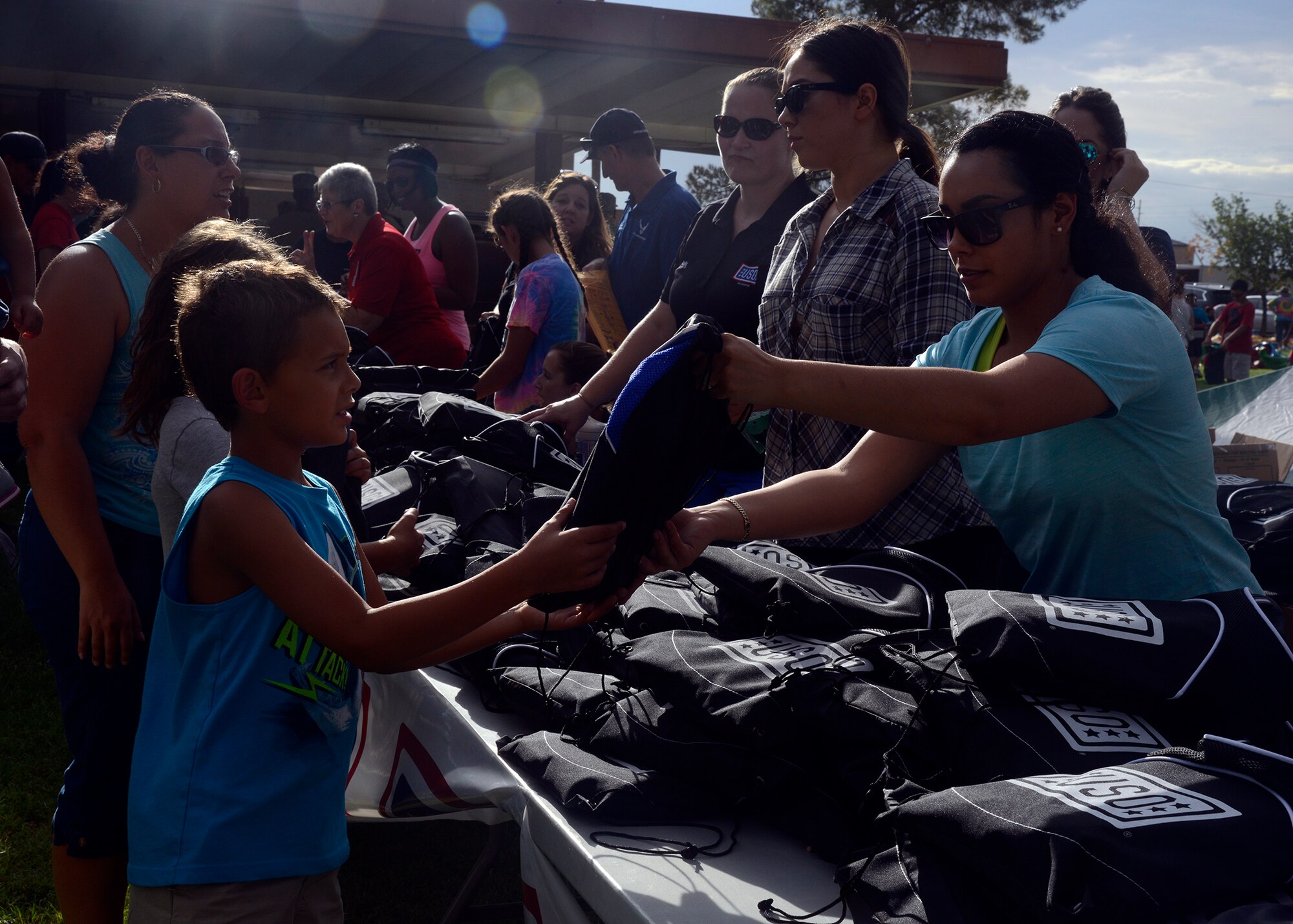 Free backpacks filled with school supplies were given to children during the Back to School Bash Aug. 2, 2016 at Luke Air Force Base, Ariz. The event was sponsored by the Luke Chapel as a way to give back to the community as well as prepare children for the upcoming school year. More than 500 people came out for the event.(U.S. Air Force photo by Senior Airman Devante Williams)