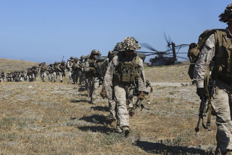 Marines with 3rd Battalion, 1st Marine Regiment line up to board an aircraft during a training exercise, aboard Marine Corps Base Camp Pendleton, Calif., July 28. Marine Heavy Helicopter Squadron (HMH) 462 and the Royal Canadian Air Force supported 3rd Battalion, 1st Marine Regiment during Rim of the Pacific (RIMPAC) 2016. (U.S. Marine Corps photo by Lance Cpl. Harley Robinson/Released)