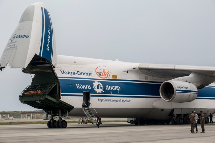Russian crew members work to unload a KC-130J flight simulator from an AN-124 Ruslan aircraft on Marine Corps Air Station Iwakuni, Japan, Aug. 2, 2016. The aircraft delivered a KC-130J flight simulator that will later be installed in the base’s Operational Training Complex. Upon its completion, MCAS Iwakuni’s OTC will be the largest in the Marine Corps. (U.S. Marine Corps Photo by Cpl. Nathan Wicks)