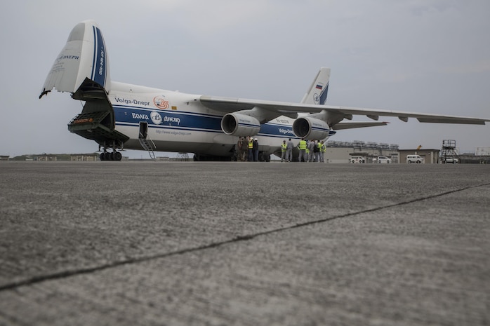 Russian crew members work to unload a KC-130J flight simulator from an AN-124 Ruslan aircraft on Marine Corps Air Station Iwakuni, Japan, Aug. 2, 2016. The aircraft delivered a KC-130J flight simulator that will later be installed in the base’s Operational Training Complex. Upon its completion, MCAS Iwakuni’s OTC will be the largest in the Marine Corps. (U.S. Marine Corps Photo by Cpl. Nathan Wicks)