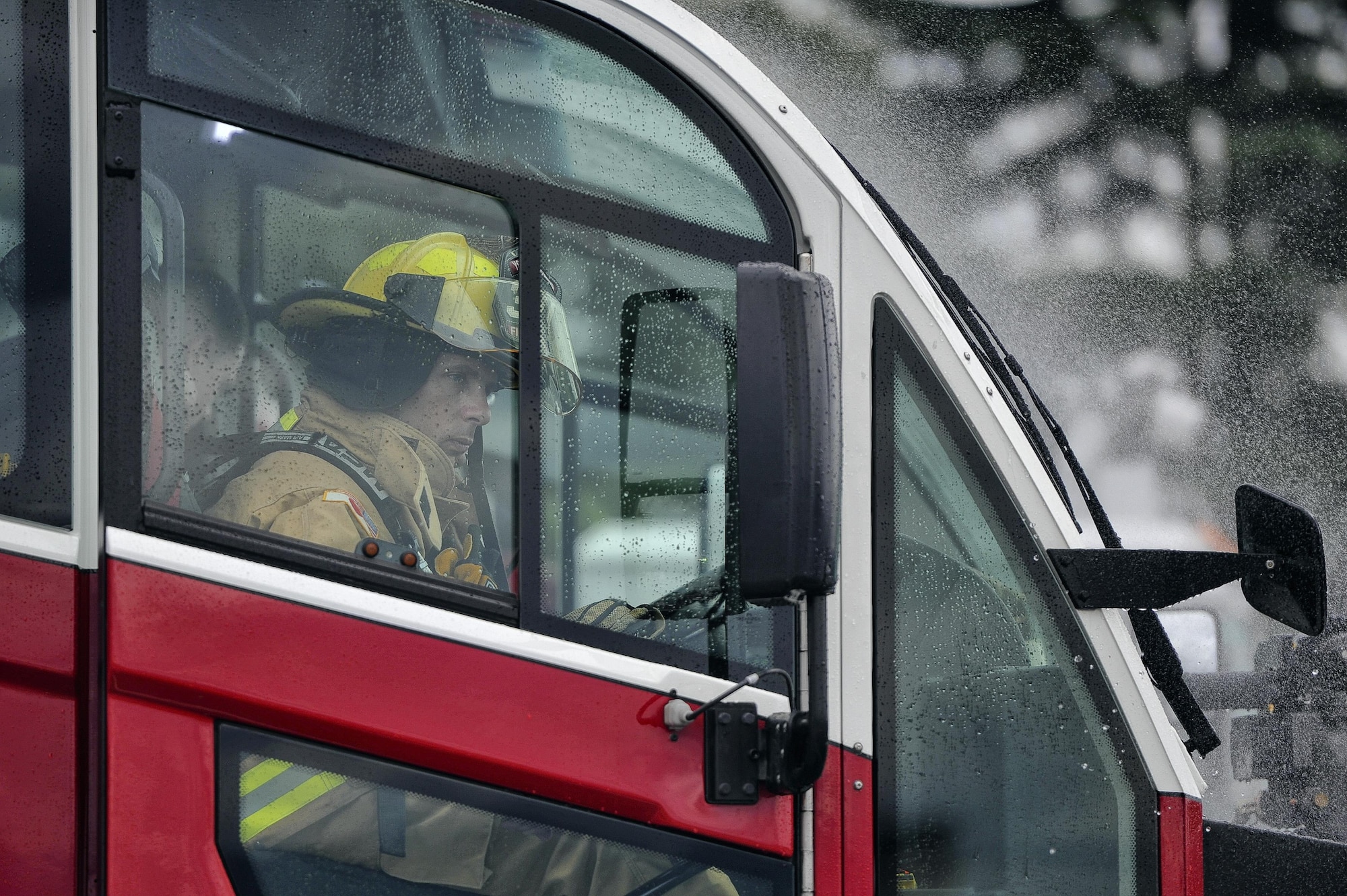 Col. Scott Maskery, 374th Mission Support Group commander, operates a firetruck hose during fire training at Yokota Air Base, Japan, Aug. 1, 2016. To learn more about how Yokota firefighters operate, Maskery trained alongside the ‘fire dogs’ to enhance his ability to advocate and fight on their behalf. (U.S. Air Force photo by Senior Airman Delano Scott/Released)