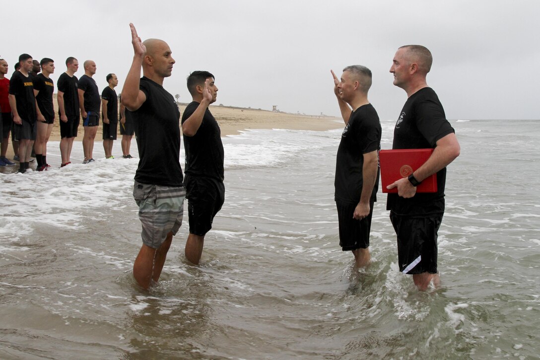 Marines with Marine Corps Recruiting Station Orange County stormed Huntington State Beach June 10, 2016 for a beach run. The purpose of the approximately four mile physical training session was to build morale, camaraderie and to conduct a reenlistment ceremony in the water for Gunnery Sgt. Kevin Aguilar and Sgt. Victor Galvan, both canvassing recruiters with RS Orange County. (U.S. Marine Corps photo by Sgt. Vanessa Jimenez)