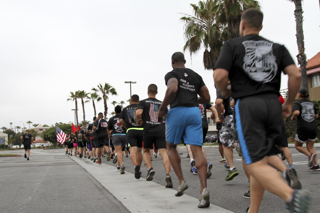 Marines with Marine Corps Recruiting Station Orange County stormed Huntington State Beach June 10, 2016 for a beach run. The purpose of the approximately four mile physical training session was to build morale, camaraderie and to conduct a reenlistment ceremony in the water for Gunnery Sgt. Kevin Aguilar and Sgt. Victor Galvan, both canvassing recruiters with RS Orange County. (U.S. Marine Corps photo by Sgt. Vanessa Jimenez)