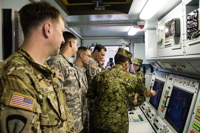 Soldiers from U.S. Army Aviation Battalion-Japan participate in a tour of the P-20 system, a mobile air traffic control platform operated by the Japan Ground Self-Defense Force, during the second Tachikawa Helicopter Conference conducted July 26, 2016, in Camp Tachikawa, Japan. Hosted by the JGSDF Eastern Army, the conference brought together representatives from the Japan Self-Defense Forces, United States military branches, and Japan’s civil aviation authorities to exchange information and develop policies to conduct helicopter operations during a major disaster. As the only rotary wing battalion stationed in Japan, USAABJ serves as U.S. Army Japan’s primary asset for aviation support. USAABJ’s close partnership with its Japanese aviation counterparts has produced a bilateral agreement for the battalion to assist in an emergency response operation or disaster relief mission if the Japanese government requests it. (U.S. Army photo by Sgt. John L. Carkeet IV, U.S. Army Japan)