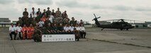 Senior leaders from approximately 20 military and civilian rotary wing organizations from Japan and United States pose for a group photo during the second Tachikawa Helicopter Conference conducted July 26, 2016, in Camp Tachikawa, Japan. Hosted by the JGSDF Eastern Army, the conference brought together representatives from the Japan Self-Defense Forces, United States military branches, and Japan’s civil aviation authorities to exchange information and develop policies to conduct helicopter operations during a major disaster. As the only rotary wing battalion stationed in Japan, U.S. Army Aviation Battalion-Japan serves as U.S. Army Japan’s primary asset for aviation support. USAABJ’s close partnership with its Japanese aviation counterparts has produced a bilateral agreement for the battalion to assist in an emergency response operation or disaster relief mission if the Japanese government requests it. (U.S. Army photo by Sgt. John L. Carkeet IV, U.S. Army Japan)