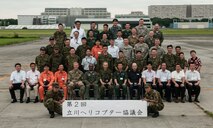 Senior leaders from approximately 20 military and civilian rotary wing organizations from Japan and United States pose for a group photo during the second Tachikawa Helicopter Conference conducted July 26, 2016, in Camp Tachikawa, Japan. Hosted by the JGSDF Eastern Army, the conference brought together representatives from the Japan Self-Defense Forces, United States military branches, and Japan’s civil aviation authorities to exchange information and develop policies to conduct helicopter operations during a major disaster. As the only rotary wing battalion stationed in Japan, U.S. Army Aviation Battalion-Japan serves as U.S. Army Japan’s primary asset for aviation support. USAABJ’s close partnership with its Japanese aviation counterparts has produced a bilateral agreement for the battalion to assist in an emergency response operation or disaster relief mission if the Japanese government requests it. (U.S. Army photo by Sgt. John L. Carkeet IV, U.S. Army Japan)