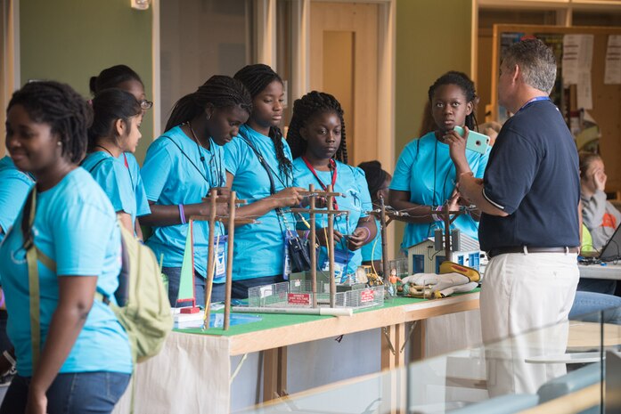 Campers learning about an electricity experiment during the SPAWAR sponsored Girls Day Out event, July 29 - 30, 2016, at the College of Charleston.