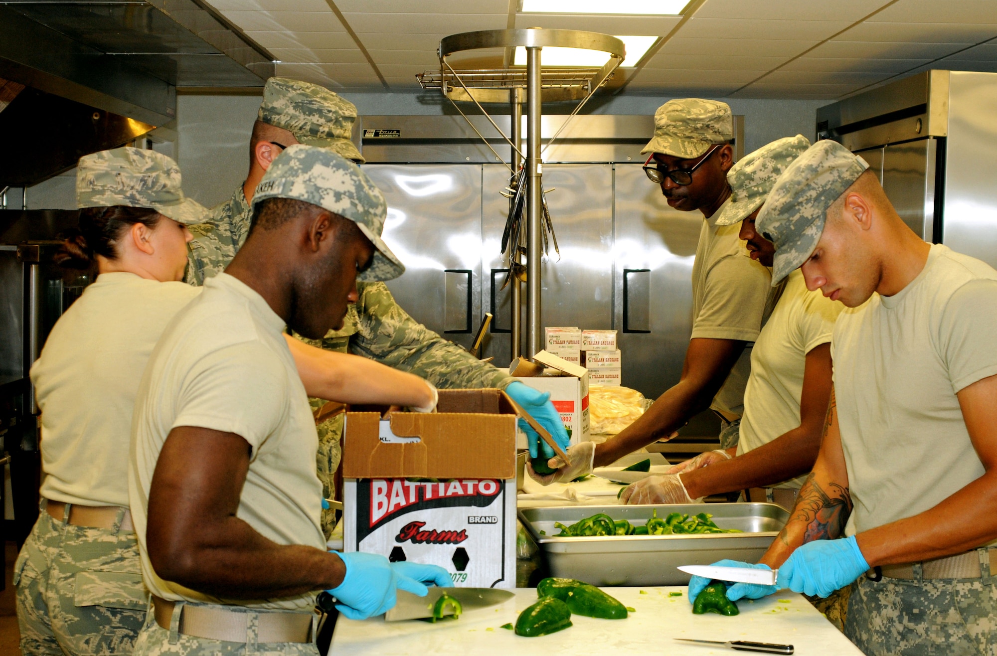 A nine-member team composed of Airmen and soldiers from across the Pennsylvania National Guard conduct line preparation and progressive cooking before a dinner for approximately 220 Guardsmen at Fort Indiantown Gap (FITG), Pa., July 25, 2016. The soldiers and Airmen are at FITG to support the National Guard’s diversified mission during the Democratic National Convention in Philadelphia. (U.S. Air National Guard photo by Staff Sgt. Michael Shaffer)