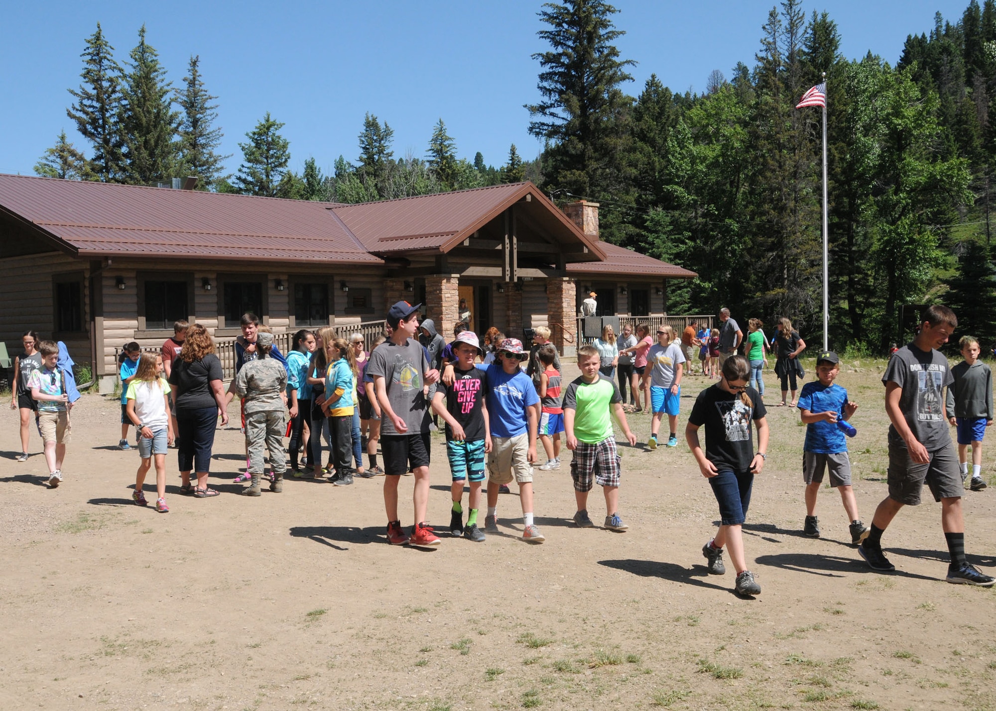 Kids leave the main lodge to gather together at the pavilion area in anticipation for a visit to Camp Runnamucka by the Adjutant General of Montana Maj. Gen. Matthew Quinn June 29, 2016. The week-long camp is designed for children of Montana National Guard children whose parents have deployed or will soon deploy. Camp Runnamucka is held each year at Camp Rotary located near Monarch, Mont. (U.S. Air National Guard photo by Senior Master Sgt. Eric Peterson)