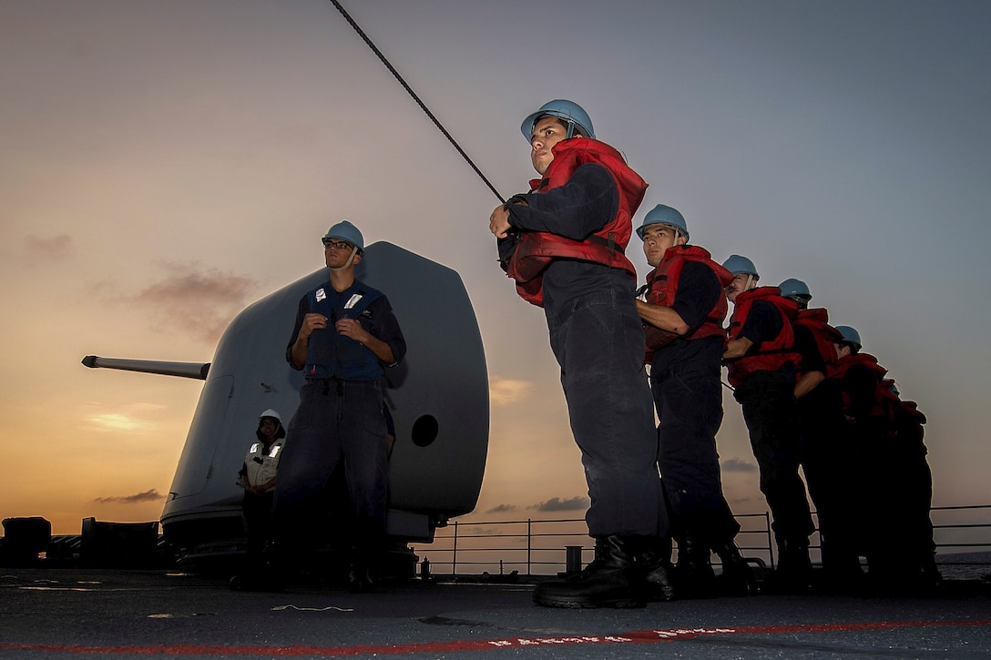 Sailors man the phone-and-distance line during a replenishment at sea on the USS Mobile Bay during Rim of the Pacific 2016, an exercise in the Pacific Ocean, Aug. 1, 2016. The maritime exercise helps participants sustain cooperative relationships critical to ensuring the safety of sea lanes and security on the world's oceans. Navy photo by Petty Officer 2nd Class Ryan J. Batchelder

