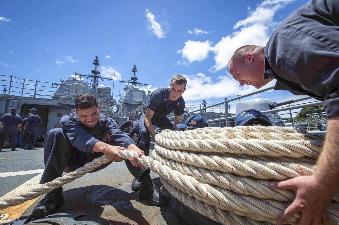 Sailors wrap line on the USS Mobile Bay after mooring alongside the USS Princeton during Rim of the Pacific 2016 near Pearl Harbor, Hawaii, Aug. 2, 2016. The maritime exercise helps participants sustain cooperative relationships critical to ensuring the safety of sea lanes and security on the world's oceans. Navy photo by Petty Officer 2nd Class Ryan J. Batchelder