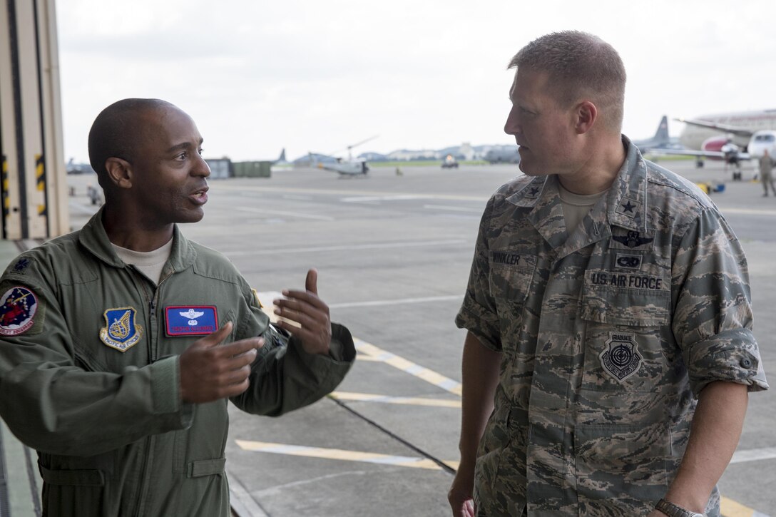 Lt. Col. Trenton Alexander, 459th Airlift Squadron director of operations, gives a mission brief to Brig. Gen. Michael Winkler, 5th Air Force vice commander, during the general’s immersion tour at Yokota Air Base, Japan, Aug. 2, 2016. Winkler was previously the commander of the 354th Fighter Wing, Eielson Air Force Base, Alaska. (U.S. Air Force photo by Yasuo Osakabe/Released)  