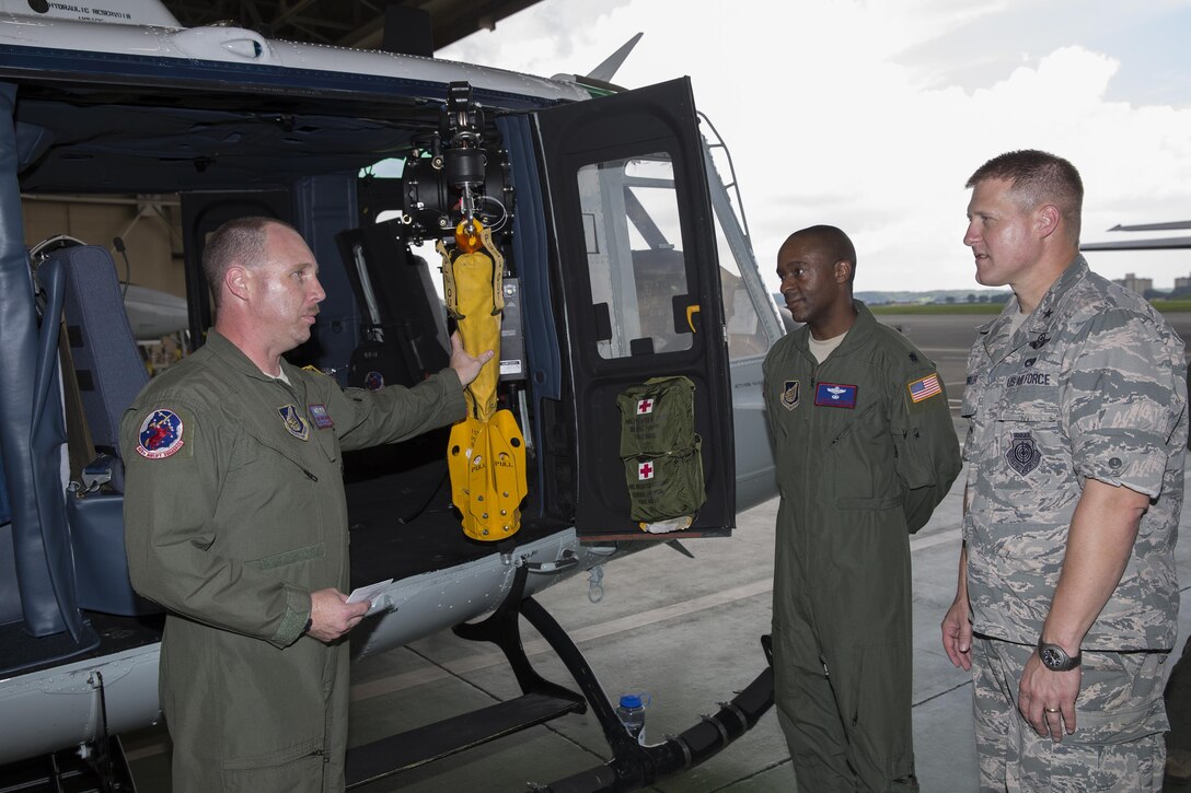 Tech. Sgt. David Jacob, 459th Airlift Squadron UH-1N special mission aviator, gives a brief to Brig. Gen. Michael Winkler, 5th Air Force vice commander, during his immersion tour at Yokota Air Base, Japan. The 459 AS conducts operational support airlift, search and rescue missions and air evacuation mission. (U.S. Air Force Photo by Yasuo Osakabe/Released) 
