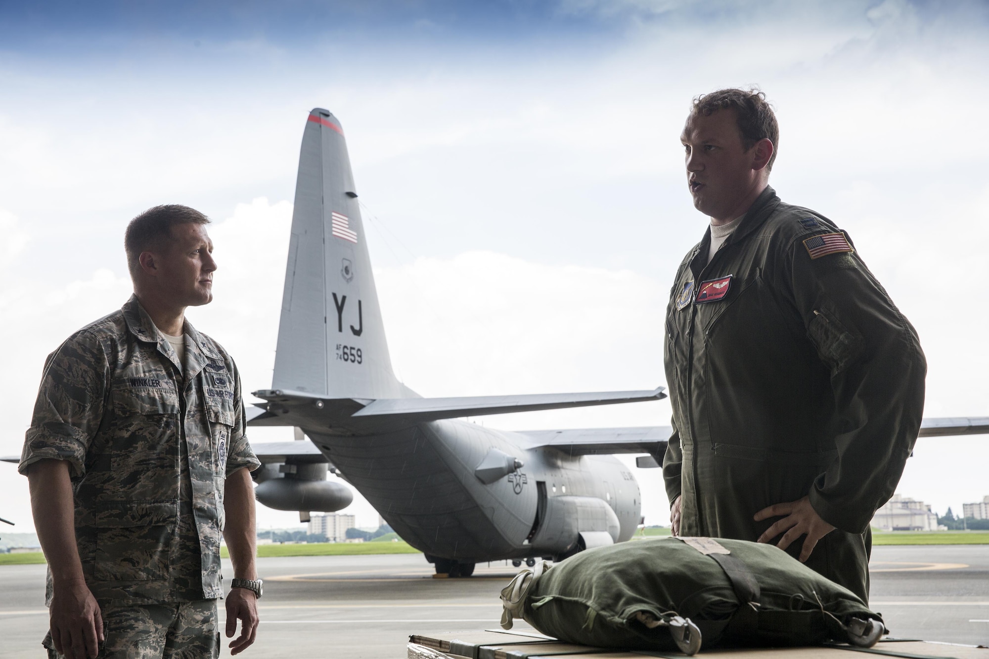 Capt. Michael Chambers, 374th Operations Support Squadron C-130 Hercules navigator, gives a C-130H mission brief to Brig. Gen. Michael Winkler, 5th Air Force vice commander, during the general’s immersion tour at Yokota Air Base, Japan, Aug. 2, 2016. Yokota provides expeditionary forces ready to employ anywhere in the world and is the airlift and operational hub for U.S. forces in the Indo-Asia Pacific Region. (U.S. Air Force photo by Yasuo Osakabe/Released)  