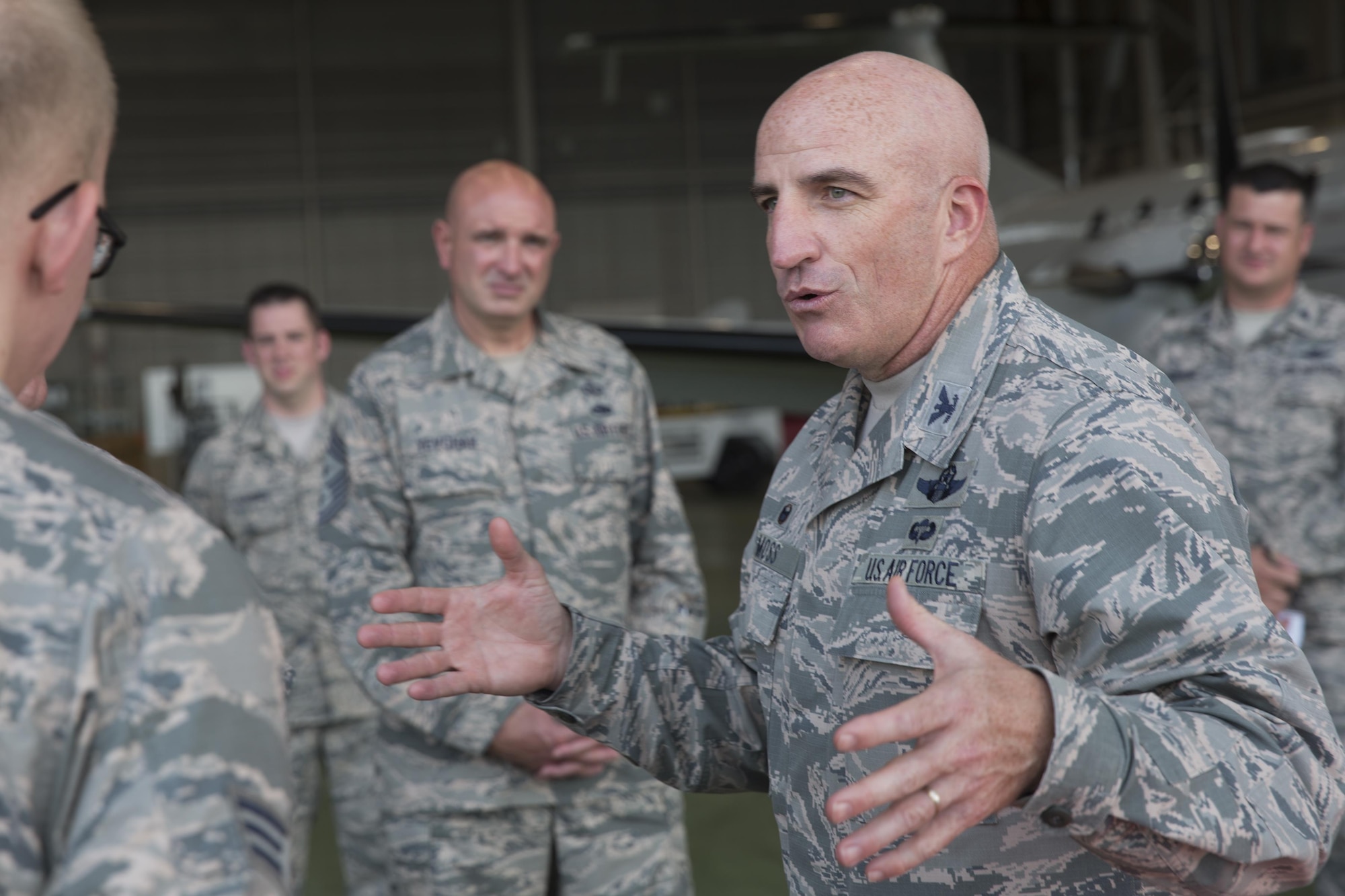 Col. Kenneth Moss, 374th Airlift Wing commander, gives a brief to Brig. Gen. Michael Winkler, 5th Air Force vice commander, during his immersion tour at Yokota Air Base, Japan, Aug. 2, 2016. Winkler spent the day touring facilities throughout Yokota to learn more about the installation’s capabilities. (U.S. Air Force photo by Yasuo Osakabe/Released) 