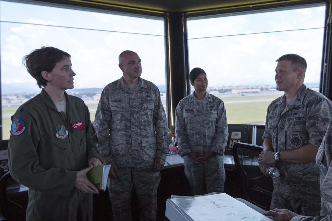 Lt. Col. Julie Gaulin, left, 374th Operations Support Squadron commander, introduces Yokota’s air traffic control tower to Brig. Gen. Michael Winkler, 5th Air Force vice commander, during the general’s immersion tour at Yokota Air Base, Japan, Aug. 2, 2016. Winkler spent the day touring facilities throughout Yokota to learn more about the installation’s capabilities. (U.S. Air Force photo by Yasuo Osakabe/Released) 