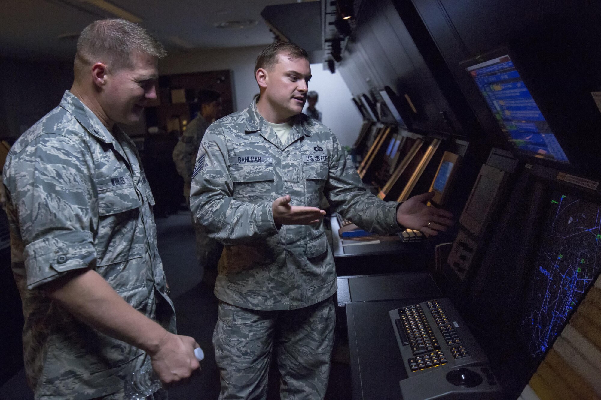 Tech. Sgt. Christopher Bahlman, 374th Operations Support Squadron air traffic control specialist, gives a brief on the operation of an approach control station to Brig. Gen. Michael Winkler, 5th Air Force vice commander, during his immersion tour at Yokota Air Base, Japan, Aug. 2, 2016. Yokota’s Radar Approach Control Airmen monitor and control aircraft over a 20,000 square mile area in the Kanto plains. (U.S. Air Force photo by Yasuo Osakabe/Released) 