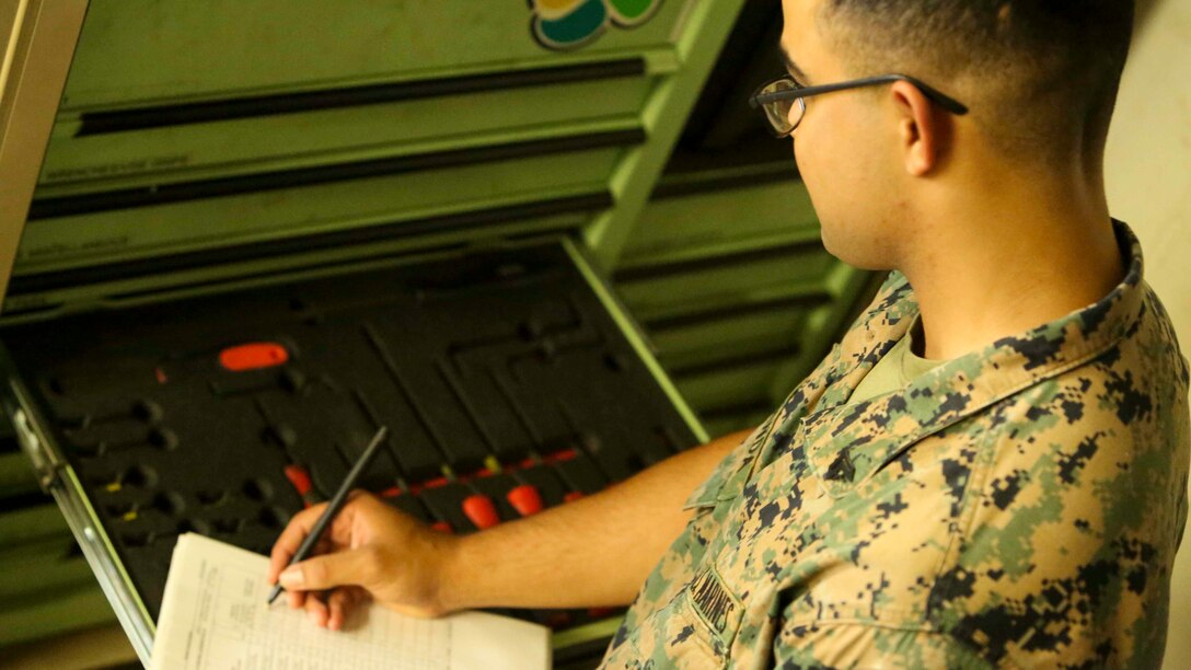 OKINAWA, JAPAN - Cpl. Misaeo Miranda, a motor transportation mechanic with III Marine Expeditionary Force Headquarters Group, conducts an inventory of various tools used by mechanics in his shop, Aug. 3, 2016. When vehicles break down, the Marine Corps relies solely on motor transportation mechanics to fix them. The various exercises that III MEF takes part in puts Marines to the test and prepares them for any crisis that might occur in the Pacific. Miranda is from Naples, Florida. (U.S. Marine Corps photo by Lance Cpl. Nathaniel Cray/ Released)