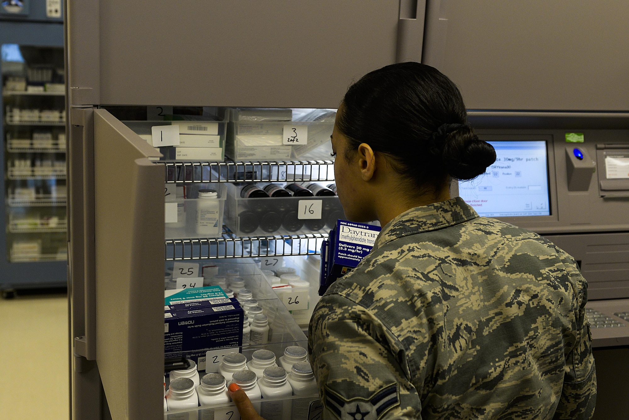 Airman 1st Class Cheyenne Saxton, 18th Medical Group pharmacy journeyman, pulls a prescription from the Pyxis MedStation system inside the pharmacy Aug. 3, 2016, at Kadena Air Base, Japan. The system helps reduce the risk of medication errors by restricting access to only one medication at a time, preventing nurses from selecting a medication from the wrong pocket. (U.S. Air Force photo by Senior Airman Stephen G. Eigel)