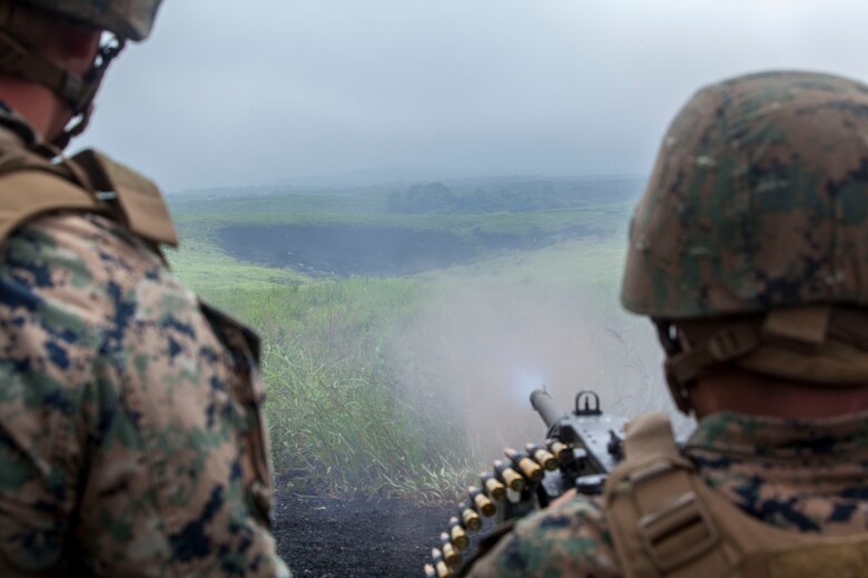 U.S. Marines with Marine Wing Support Squadron (MWSS) 171 stationed at Marine Corps Air Station Iwakuni, Japan, shoot an M2 .50-caliber heavy-machine gun as part of a machine-gun range during exercise Eagle Wrath 2016 at Combined Arms Training Center Camp Fuji, July 16, 2016. The annual exercise focuses on providing aviation-ground support to an assigned aviation combat element while reinforcing skills that Marines learned throughout their military occupational specialty schooling and Marine Combat Training. MWSS-171 conducts this exercise once a year in order to train all the Marines within the squadron, enhance their technical skills, field experience and military occupational specialty capability. (U.S. Marine Corps photo by Lance Cpl. Aaron Henson)