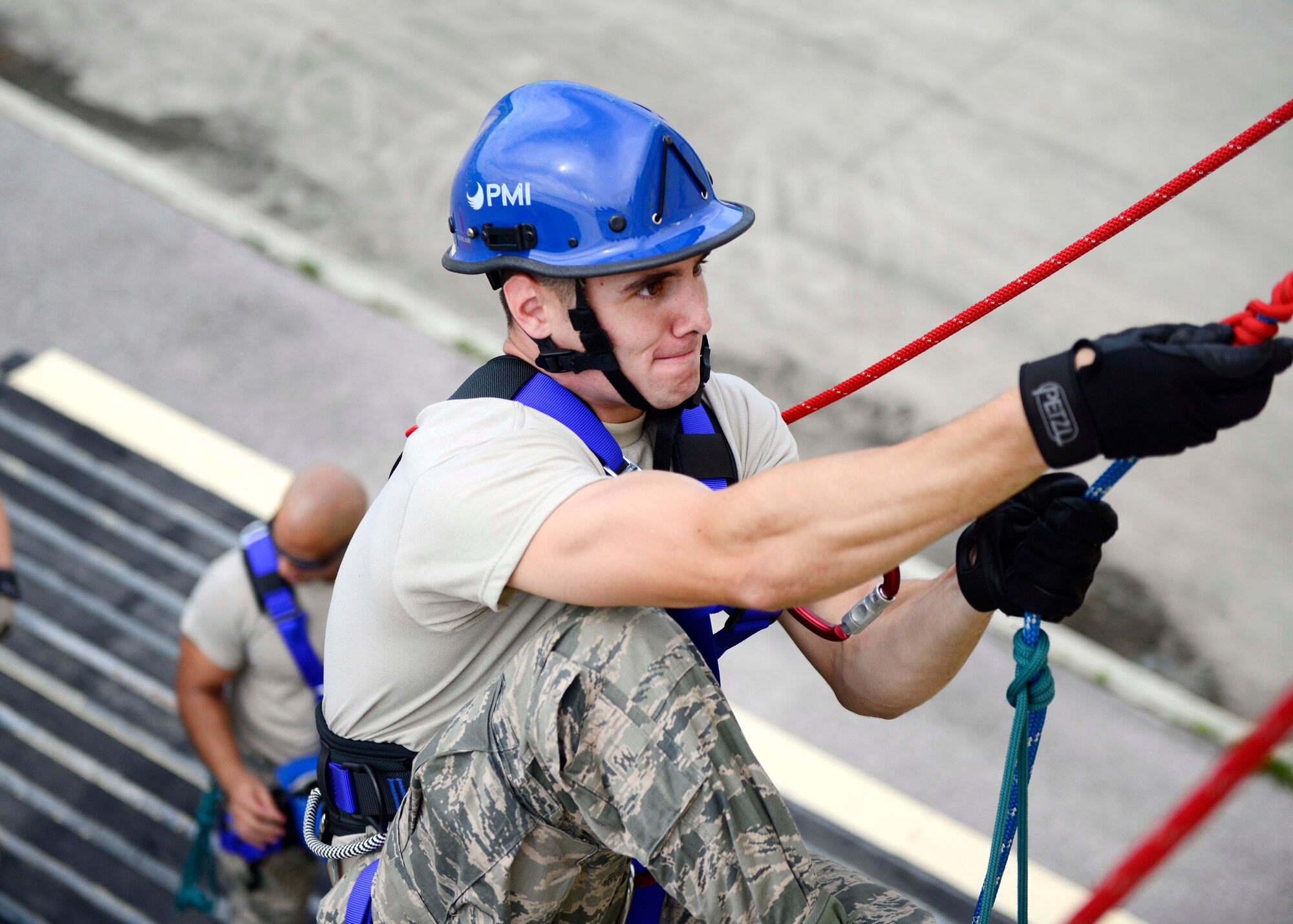 Airman Ryan Neuville, 31st Civil Engineer Squadron fire protection apprentice, climbs the side of a building during a Rescue Technician One course, Aug. 8, 2016, at Aviano Air Base, Italy. Instructors from the 435th Construction and Training Squadron from Ramstein Air Base, Germany are conducting a 15-day course that teaches firefighters unique rescue techniques. (U.S. Air Force photo by Senior Airman Areca T. Bell/Released) 