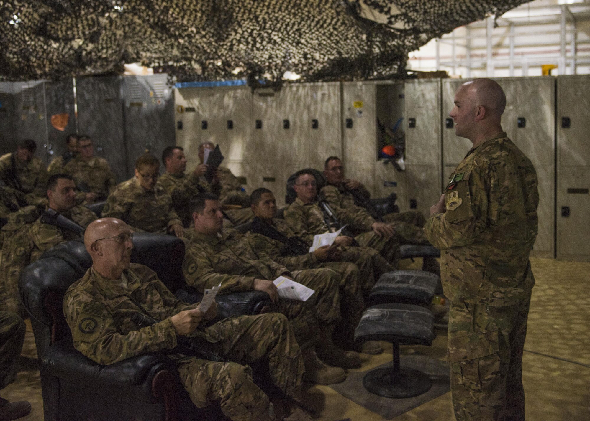 Tech. Sgt. John Havens, 455th Expeditionary Security Forces Squadron, Check Six instructor, briefs a class on actions to take in case of an active shooter threat, Bagram Airfield, Afghanistan, Aug. 02, 2016. Check Six employs a 3+2+1 solution to teach individuals how to be react during an active shooter threat. There are three actions to choose; barricade, fight or escape, two outcomes; to survive or not and one chance to get it right. (U.S. Air Force photo by Senior Airman Justyn M. Freeman)