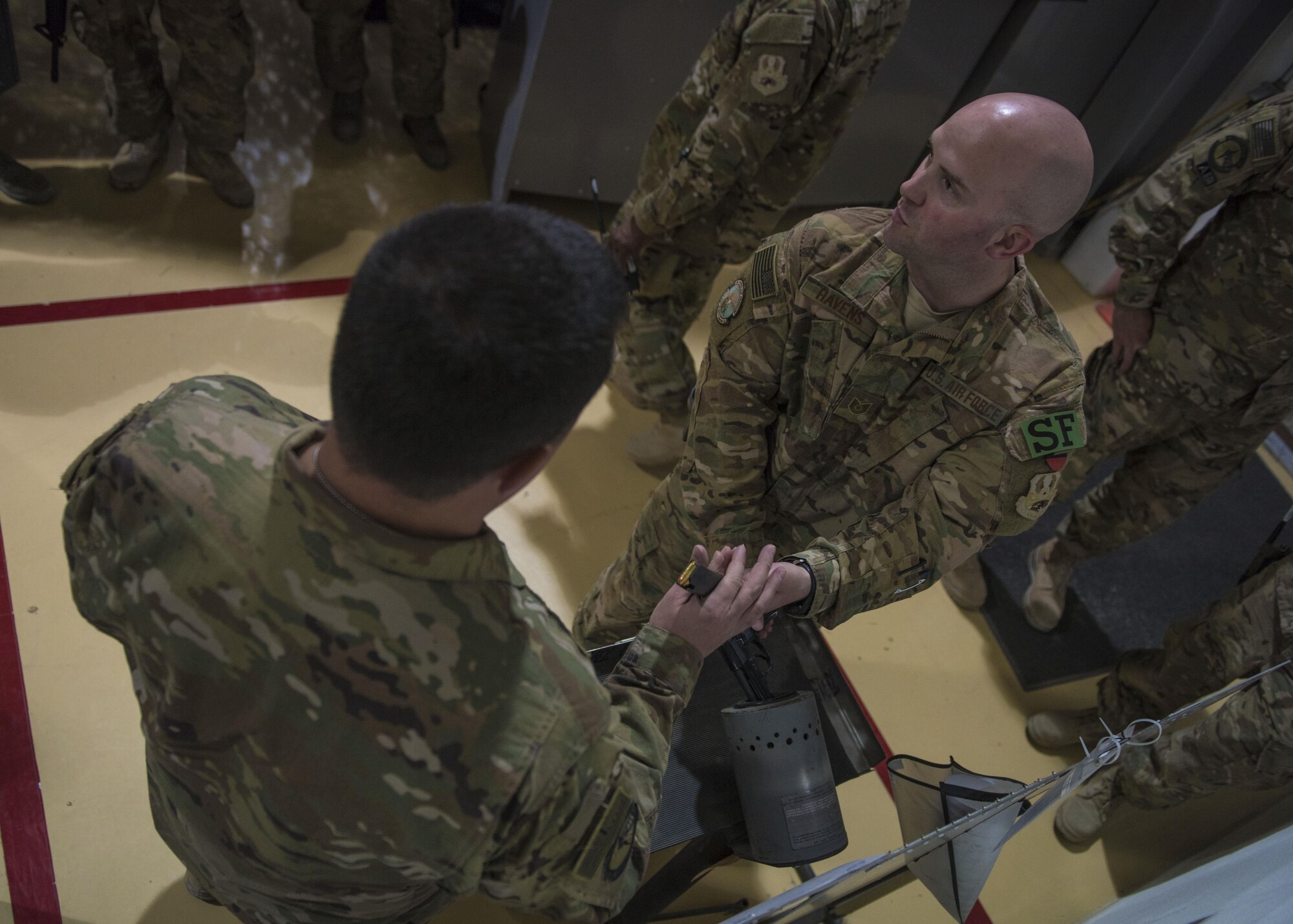 Tech. Sgt. John Havens, 455th Expeditionary Security Forces Squadron, Check Six instructor, exhibits how to properly clear a weapon, Bagram Airfield, Afghanistan, Aug. 02, 2016.  Check Six instills weapons system confidence and prepares individuals for an active shooter threat. It’s designed to minimize casualties in the case of hostilities. (U.S. Air Force photo by Senior Airman Justyn M. Freeman)