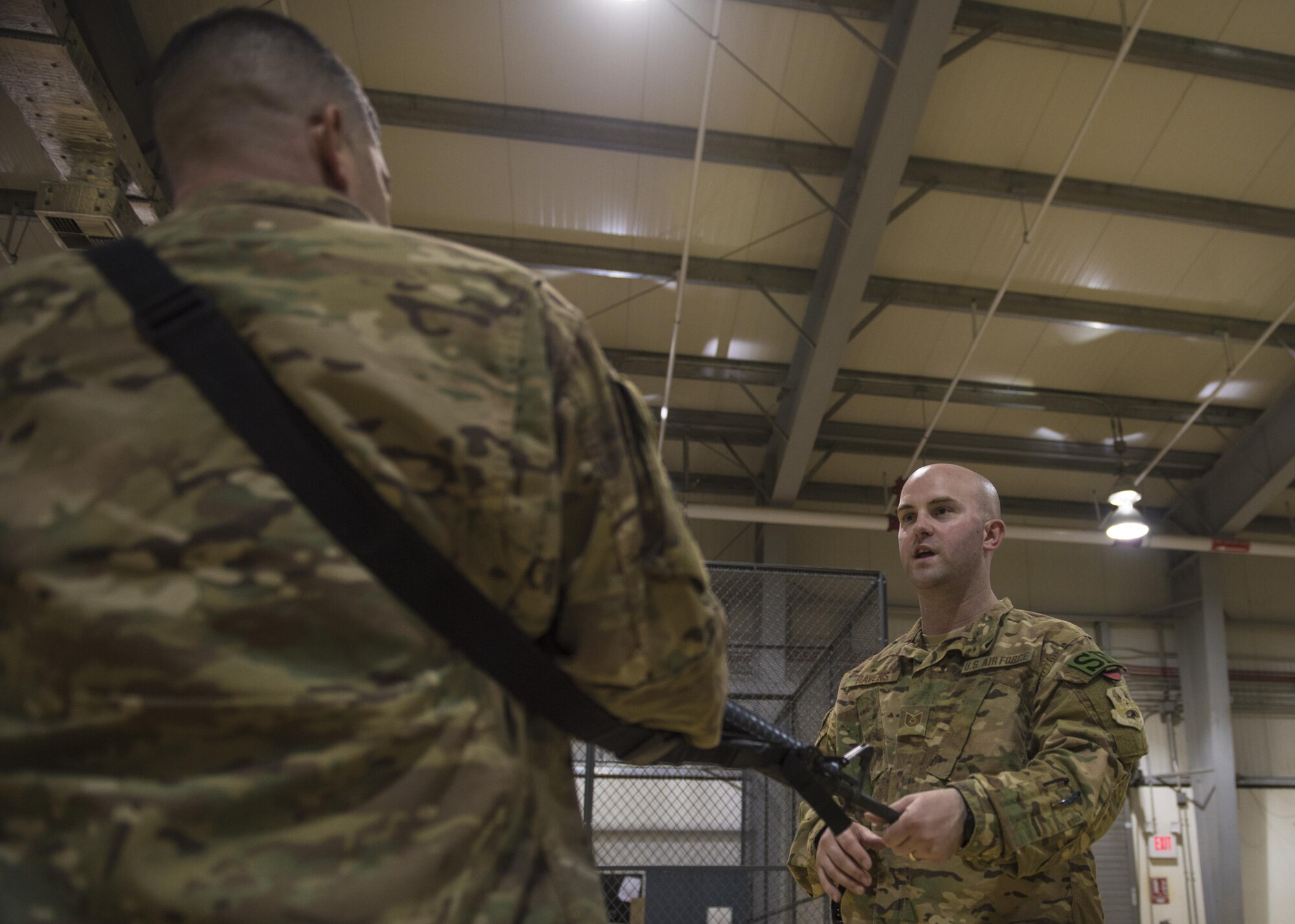 Tech. Sgt. John Havens, 455th Expeditionary Security Forces Squadron Check Six instructor and Staff Sgt. Rainier Soto, 455th Expeditionary Maintenance Squadron, practice weapons reaction drills, Bagram Airfield, Afghanistan, Aug. 02, 2016. The Check Six program was developed due to increased active shooter and insider threats. (U.S. Air Force photo by Senior Airman Justyn M. Freeman)