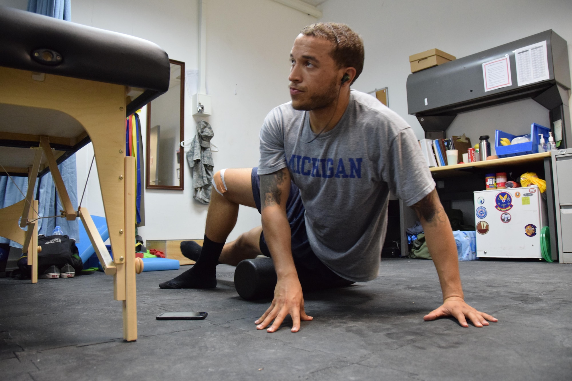 U.S. Army Sgt. Karl Hawthorne, Combined Air Operations Center air defense communications and tactics specialist, uses a foam roller July 28, 2016, at Al Udeid Air Base, Qatar. Hawthorne uses the foam roller to maintain flexibility and increase the blood flow to muscle groups in his legs during his treatment program. (U.S. Air Force photo/Technical Sgt. Carlos J. Treviño/Released)