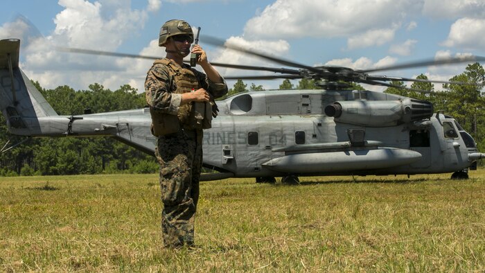 Cpl. Robert Blakeslee, an electric equipment repair specialist with 2nd Air Naval Gunfire Liaison Company, directs a CH-53E Super Stallion where to land July 28, 2016 during a troop lift exercise at Marine Corps Air Station New River. The CH-53E Super Stallion is the largest helicopter in the United States military, and able to carry a 26,000-pound Light Armored Vehicle, 16 tons of cargo, or enough combat-loaded Marines to lead an assault or humanitarian operation. The capabilities provided by the CH-53E strengthen the expeditionary capabilities of Marines Corps units and make this aircraft one of the most useful in the Marine Corps. The CH-53E is attached to Marine Heavy Helicopter Squadron 461, Marine Aircraft Group 29, 2nd Marine Aircraft Wing. ANGLICO is part of the II Marine Expeditionary Force Headquarters Group.
