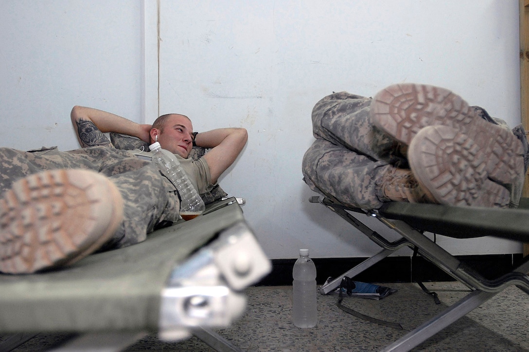 Soldiers with the 2nd Infantry Division rest on military cots during their deployment in support of Operation Iraqi Freedom in June 2010. DLA Troop Support's Construction and Equipment supply chain provides military cots for warfighters and for disaster relief operations, and sent 400 to Alaska for use during a training exercise this summer.
