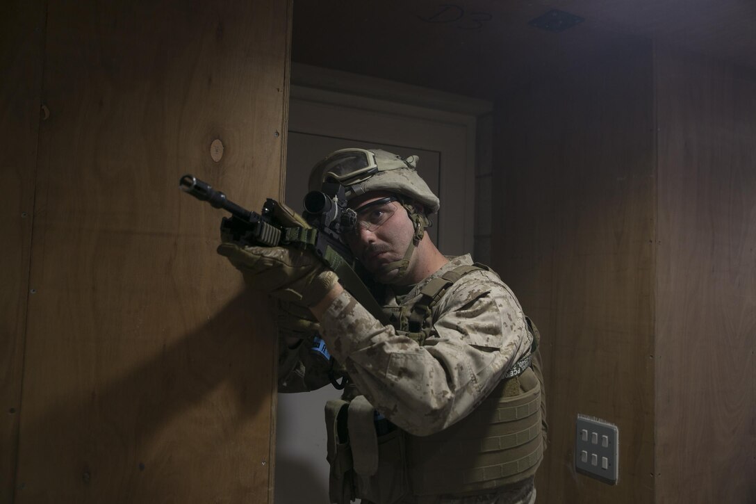 Cpl. Justin Hale, 5th Plt., Charlie Co., Fleet Anti-Terrorism Support Team, Marine Corps Security Force Regiment, posts security during Tartan Eagle 16 Close-Quarters Battle training at the Northumbria Tactical Training Center in Northumbria, England, July 25, 2016. The CQB portion of Tartan Eagle allowed Marines and sailors to integrate with their British counterparts from 43 Fleet Protection Group Royal Marines and exchange tactics while also learning new tactics. Tartan Eagle is an annual training event that began in 1994. (Official Marine Corps photo by Sgt. Calvin Shamoon/Released)